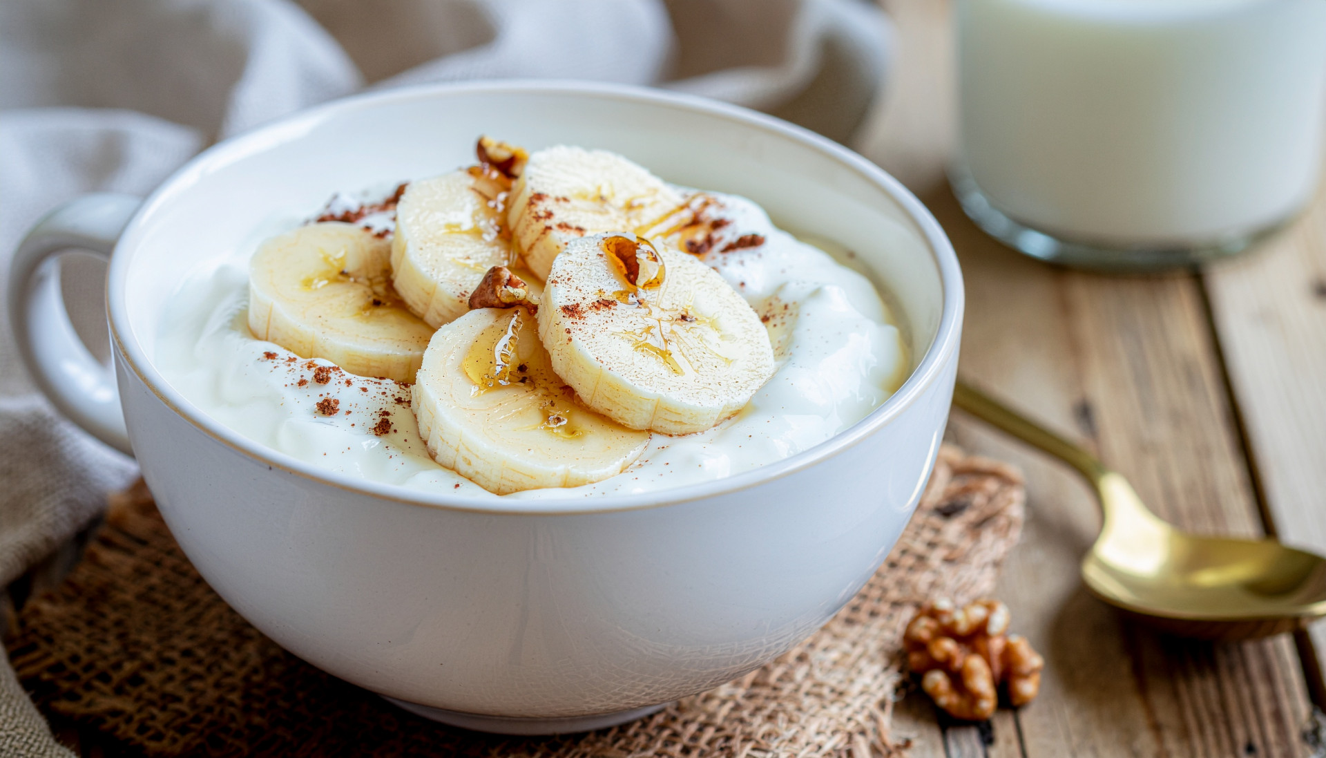 Warm Yogurt Banana Bowl - Yogurt topped with warm banana and peanut butter drizzle